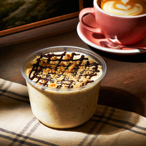 Nonna Lia hazelnut semifreddo – authentic Italian frozen dessert topped with crushed hazelnuts and chocolate drizzle, handcrafted in Canada.